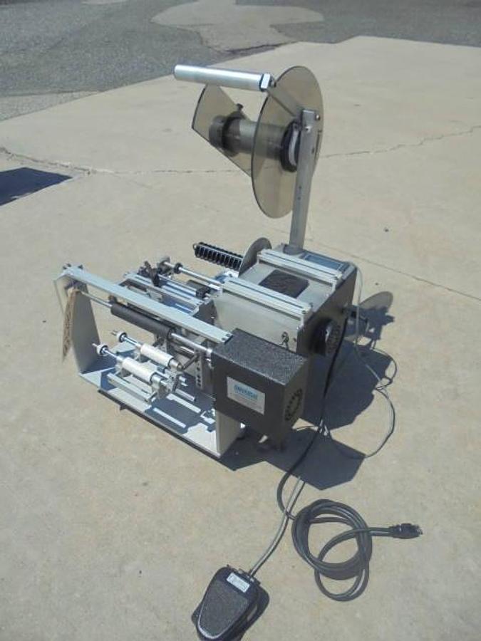 Used Universal R310 Tabletop Semi-Auto Pressure Sensitive Spot/Wraparound Labeler
