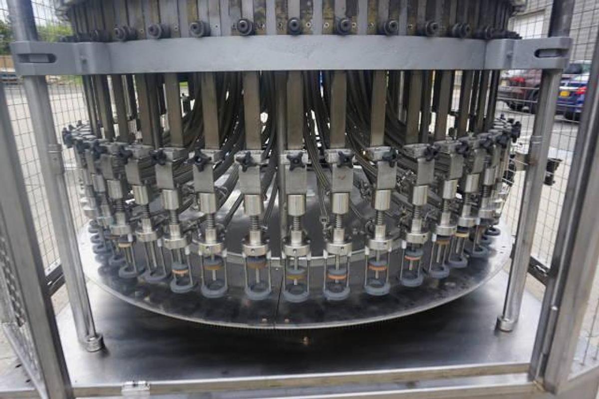 Used U.S. Bottlers 48 Valve Rotary Gravity Filling Machine, Last Filling Alcohol