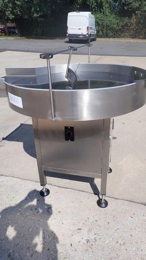 Used Metica 36 in. SS Rotary Unscrambling/Accumulating Table w/Shelf
