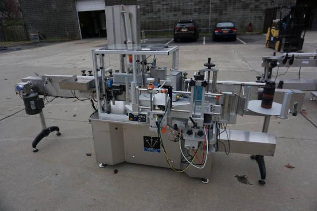 Used Aesus Systems “Eco Wrap Prism” Automatic Pressure Sensitive Spot/Wrap Around Labeler, Stainless Steel
