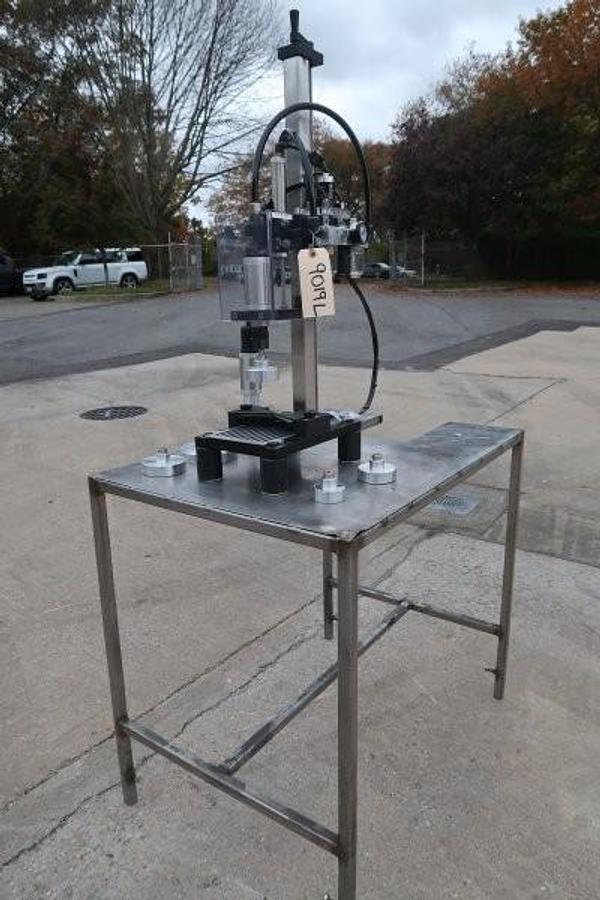 Used Kinex Air Operated Chuck Style Capper with Bench Top Table