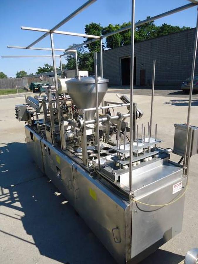 Used Modern Packaging Three Lane Cup Filler/Sealer/Lidder , Stainless Steel