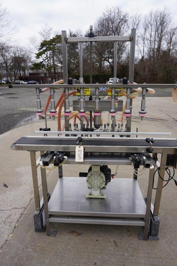 Used 8 Spout Straight Line Liquid Overflow Filler With Diaphragm Pump