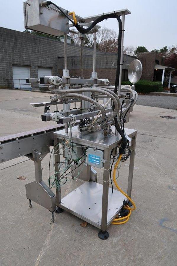 Used Inline Filling Systems 4 Spout Overflow Straight Line Liquid Filler, Stainless Steel
