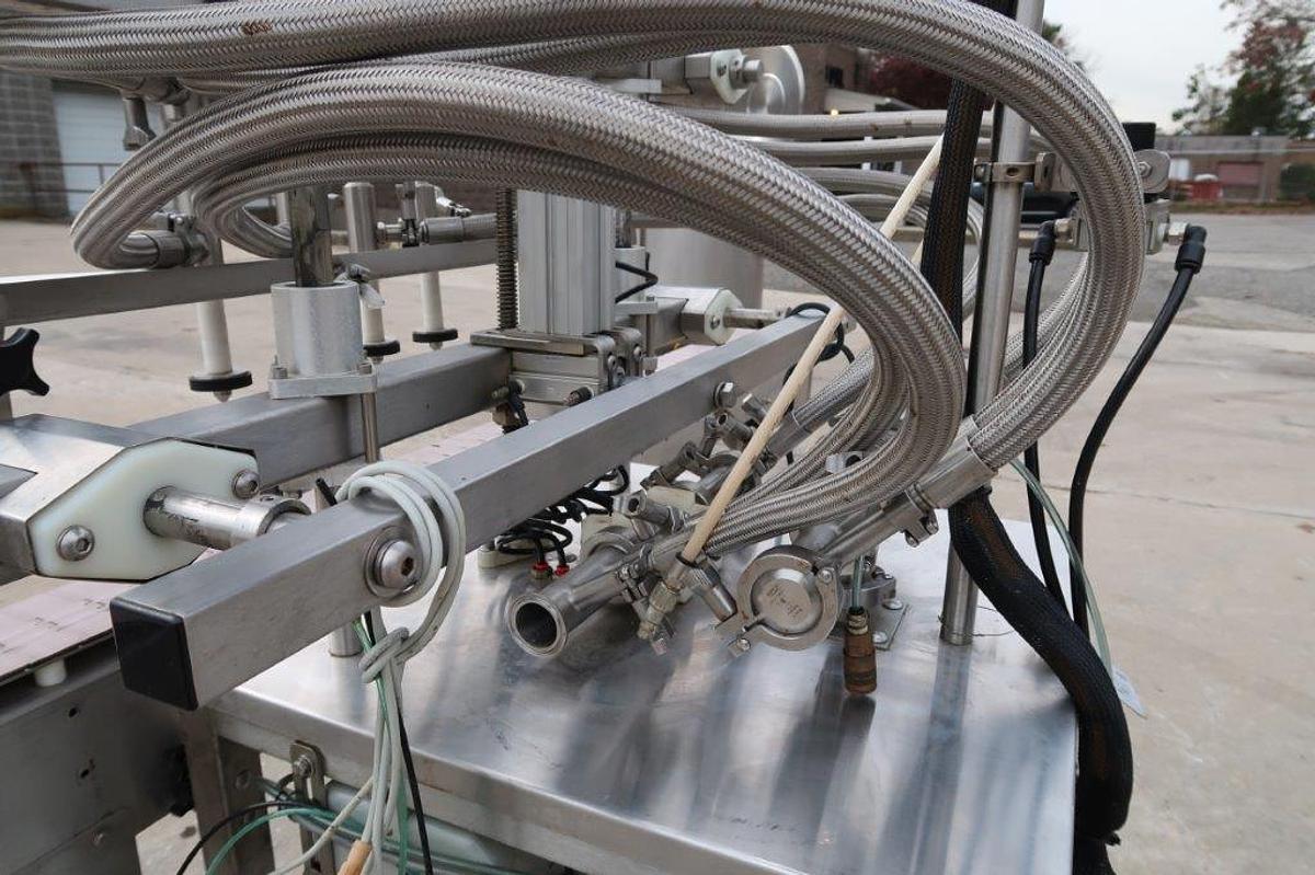 Used Inline Filling Systems 4 Spout Overflow Straight Line Liquid Filler, Stainless Steel