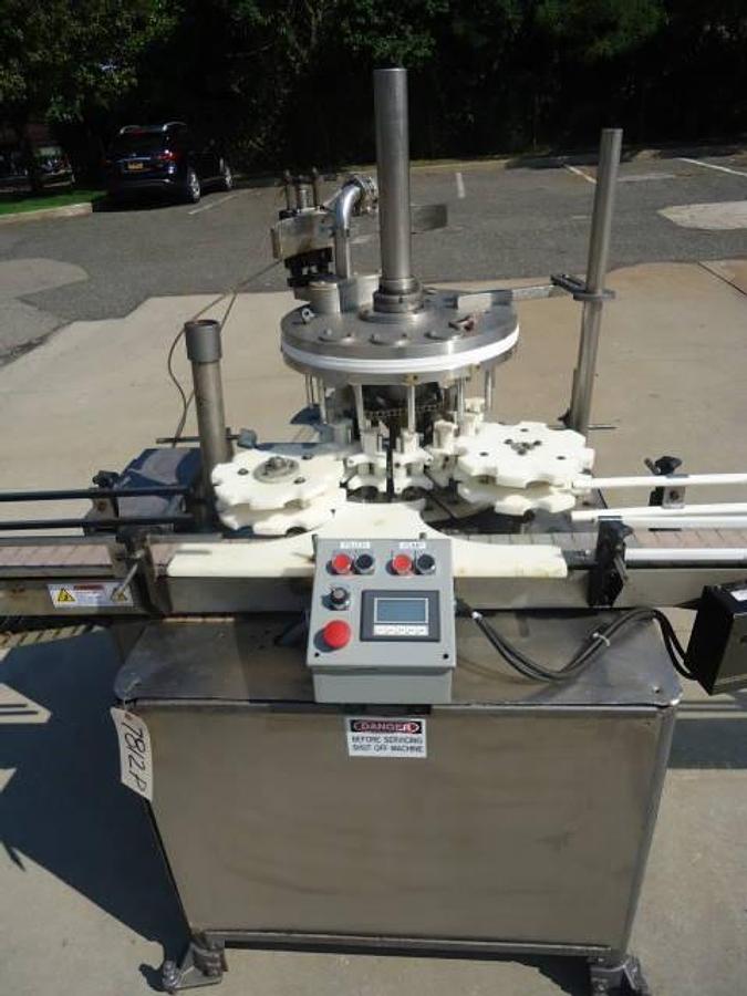 Used MRM Versafil Twelve Spout Rotary Positive Displacement Filler With Conveyor