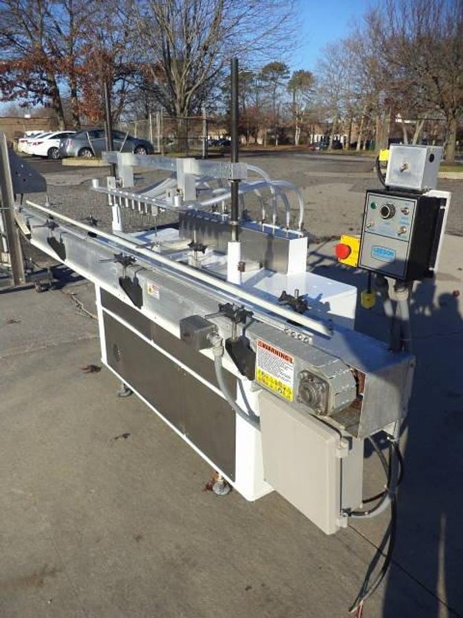 Used Cozzoli Eight Piston Straight Line Automatic Filing Machine, 240cc Pistons