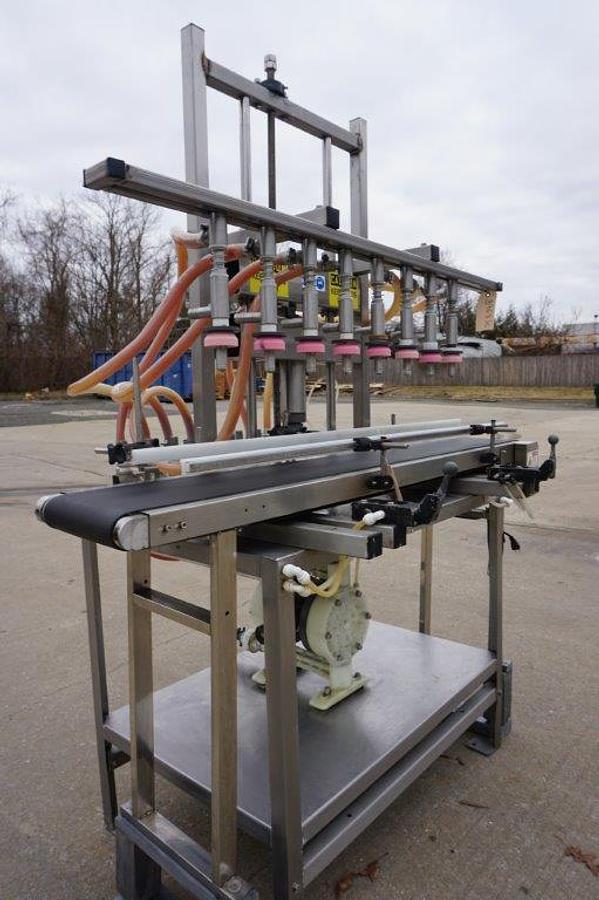 Used 8 Spout Straight Line Liquid Overflow Filler With Diaphragm Pump