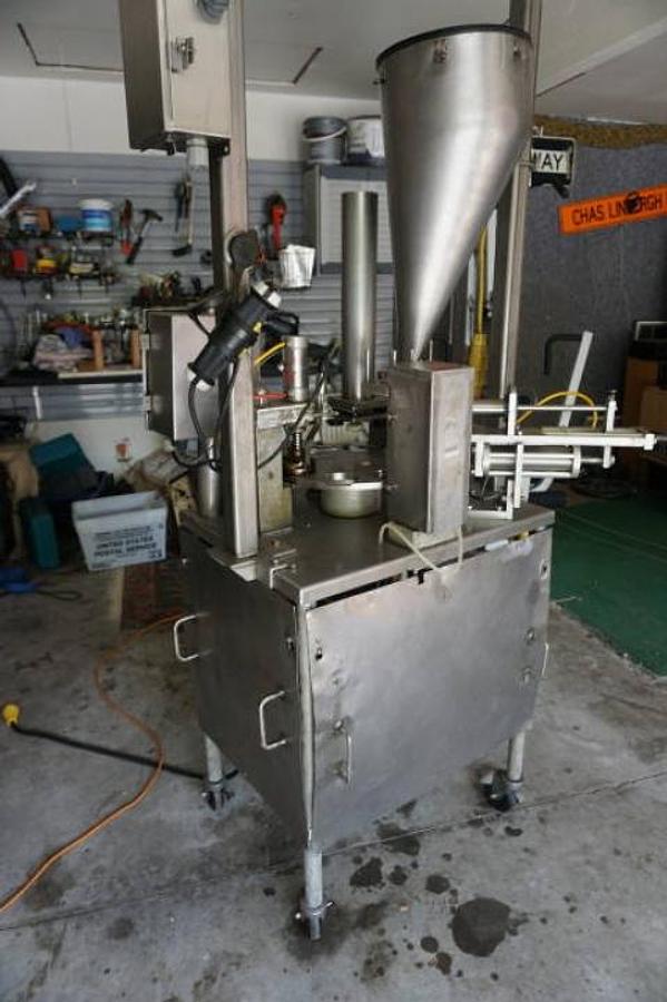 Used World Cup Model 8-12 Rotary Cup Filling/Sealing Machine, 45 Per Minute
