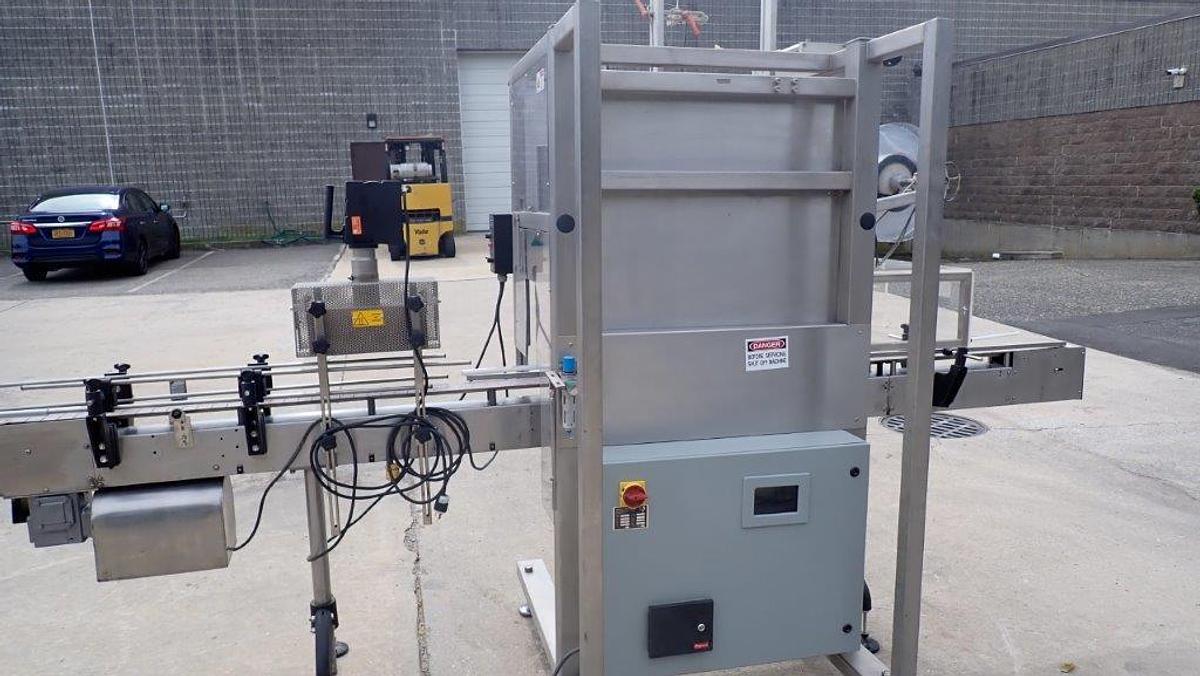 Used Aesus “Delta” High-Speed Neck Bander with Shrink Tunnel