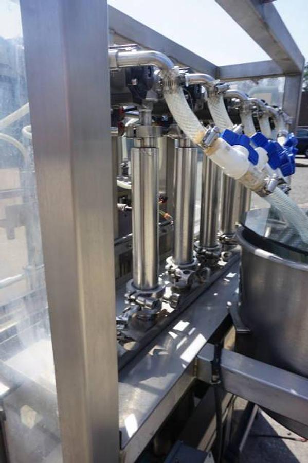 Used Biner Ellison Six Head Straight Line Piston Filling Machine