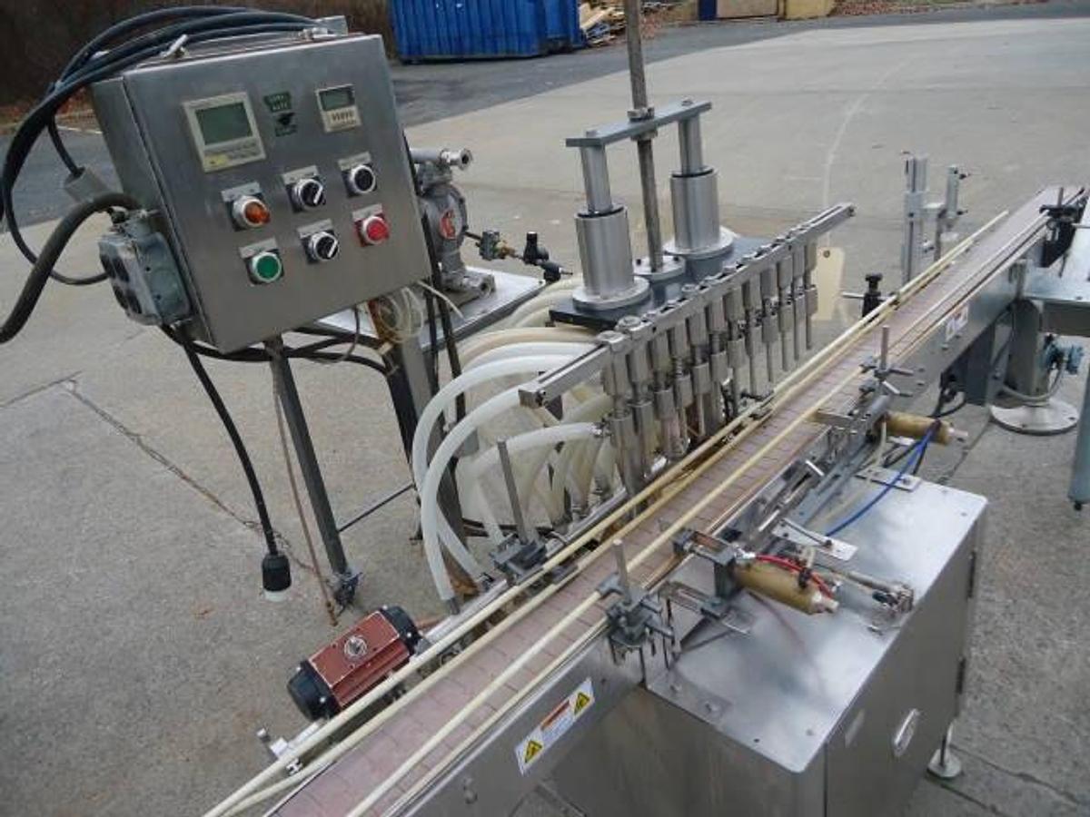 Used Jg Machine Works Twelve Spout Automatic Pressure Gravity Filler