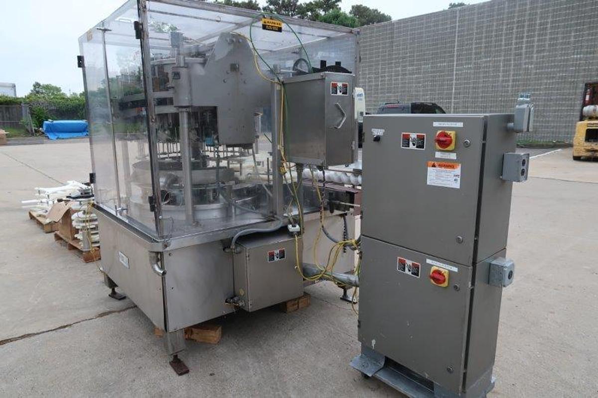 Used MRM/Elgin 16 Head Rotary Piston Filler, up to 32 Oz.