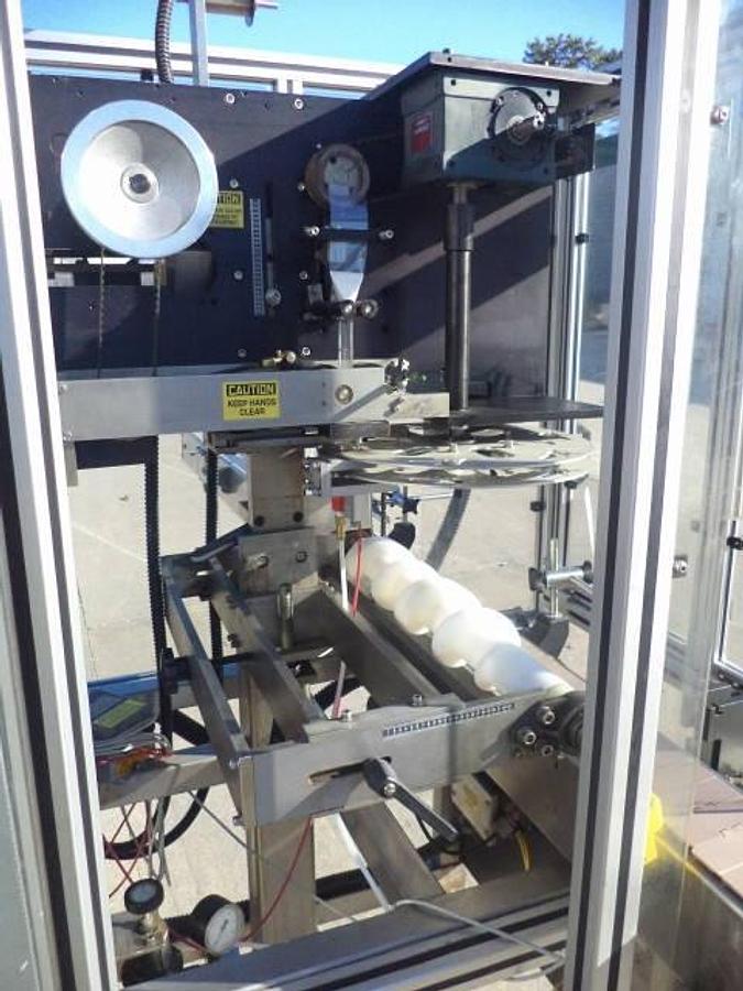 Used PDC 65-M Tamper Evident Neck Bander/Sleever, 200 pm