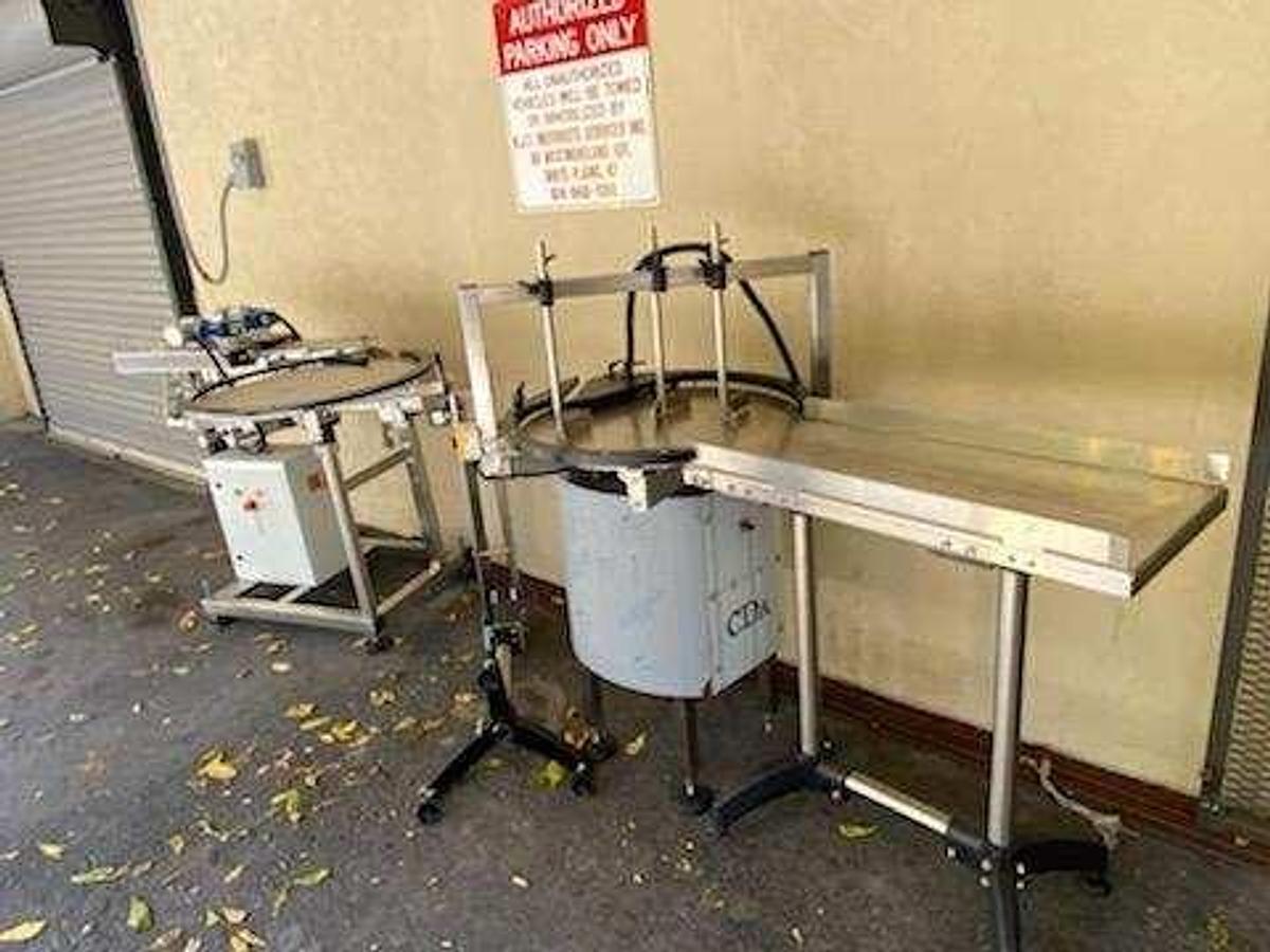 Used CDA Bottling Line with Rotary Tables