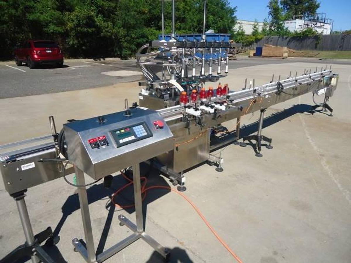 Used Inline Filling Systems Six Head Level Head Overflow Pressure Filler With 20 Ft. Conveyor