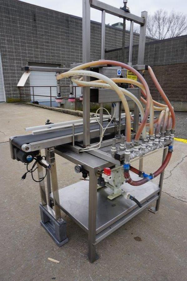 Used 8 Spout Straight Line Liquid Overflow Filler With Diaphragm Pump
