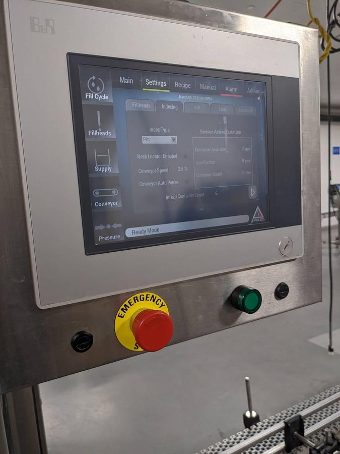 Used Apacks Six Head Automatic Mass Flow Meter Pressure Filling Machine, with conveyor