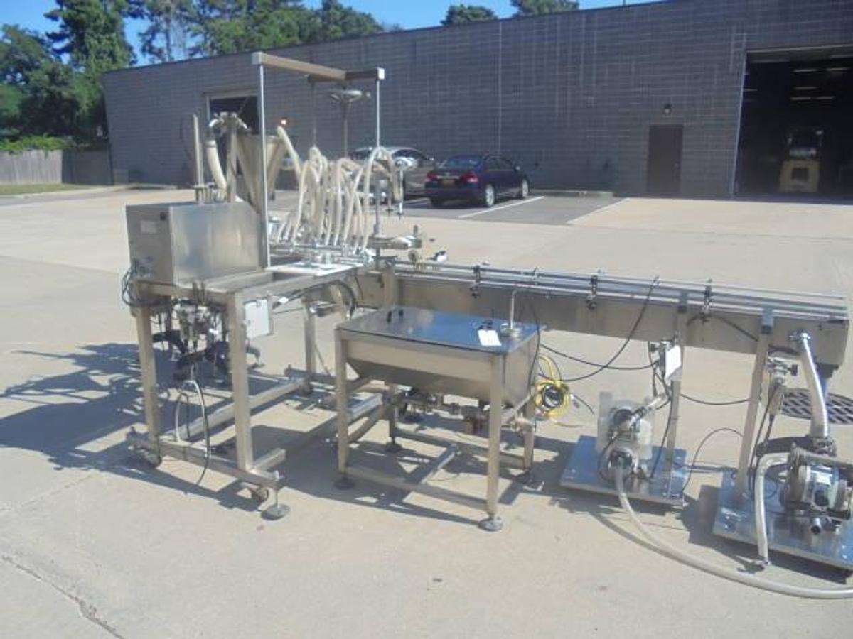 Used Inline Filling Systems “Servo” Six Nozzle Positive Displacement Pump Style Filler