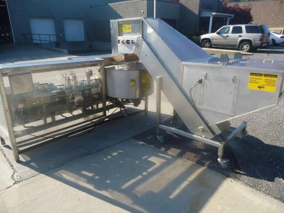 Used PACE PHARMA-LINE M300 STAINLESS STEEL PLASTIC BOTTLE UNSCRAMBLER WITH ELEVATOR