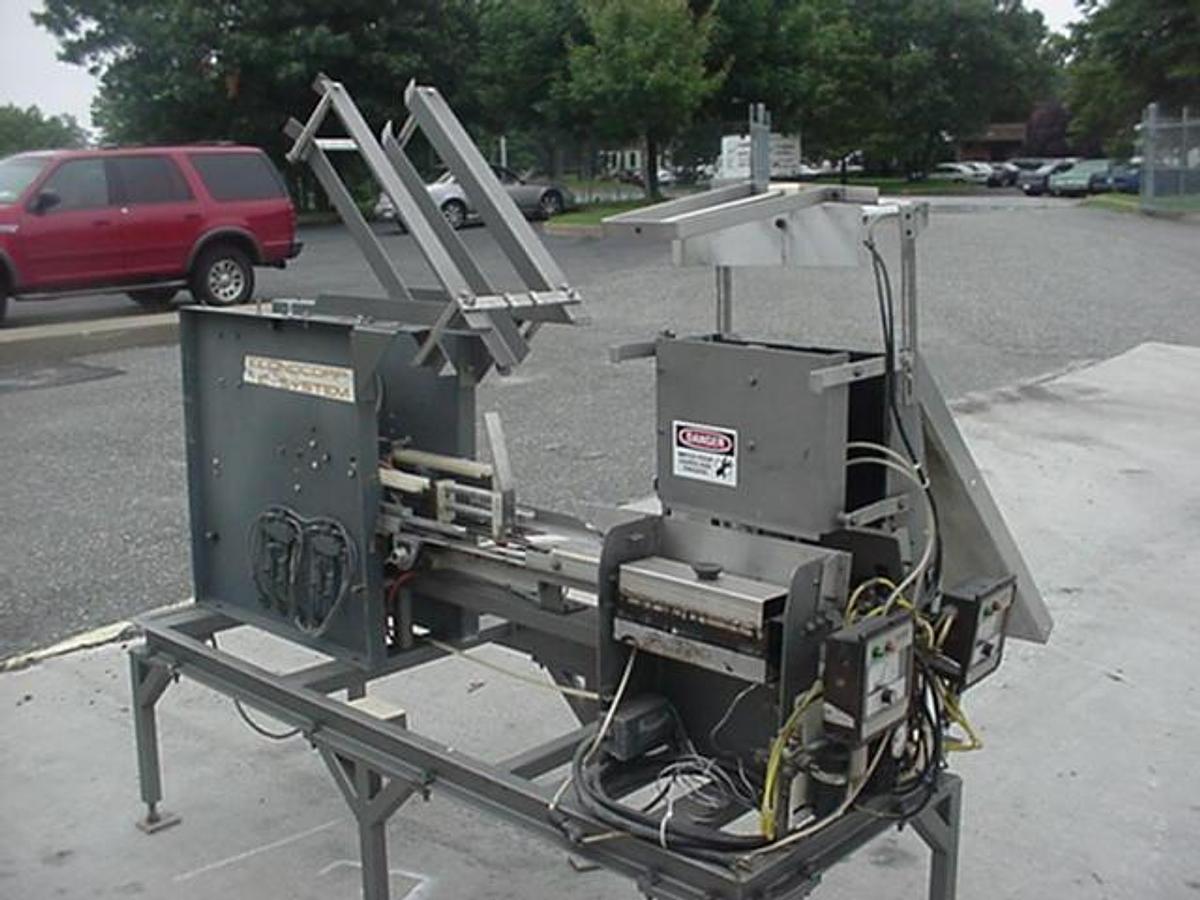 Used Econocorp “E” Automatic Cartoner, Sleeve Style Carton
