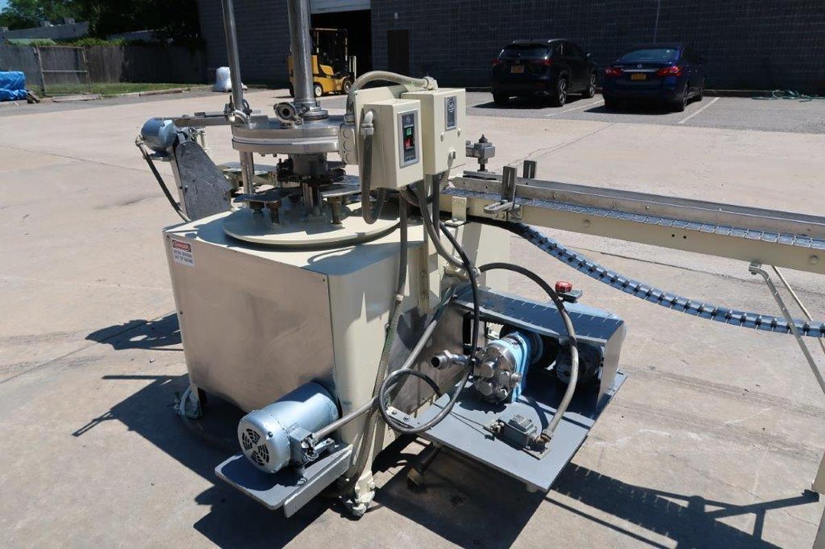 Used MRM “Versa-Fil” Six Head Rotary Time and Pressure Positive Displacement Filling Machine, with Waukesha Pump