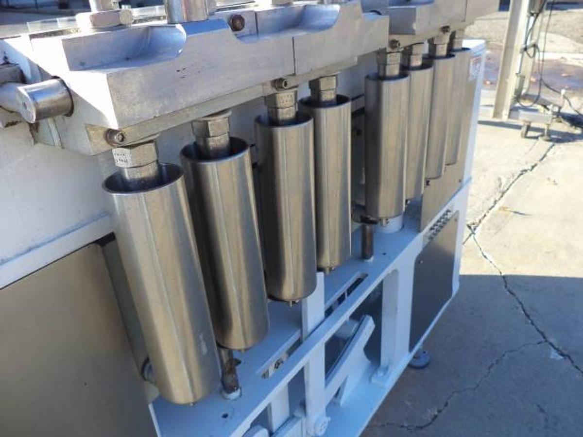 Used Cozzoli Eight Piston Straight Line Automatic Filing Machine, 240cc Pistons