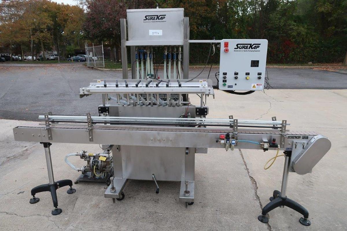 Used Surekap 8 Head Inline Auto Piston Filler, Explosion Proof