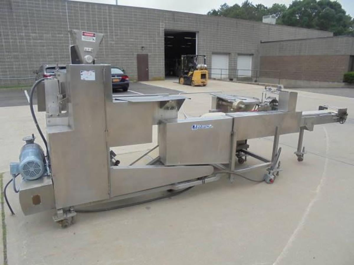 Used Colborne T-28000 Automatic Turnover Pie Machine, tooled currently for Jamaican Beef Patties