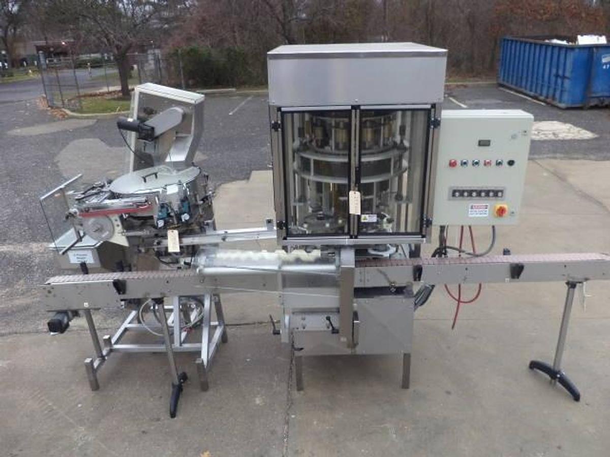 Used New England Machinery Ten Head Rotary Capper With Feeder/Unscrambler