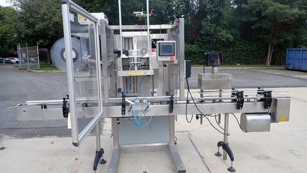 Used Aesus “Delta” High-Speed Neck Bander with Shrink Tunnel