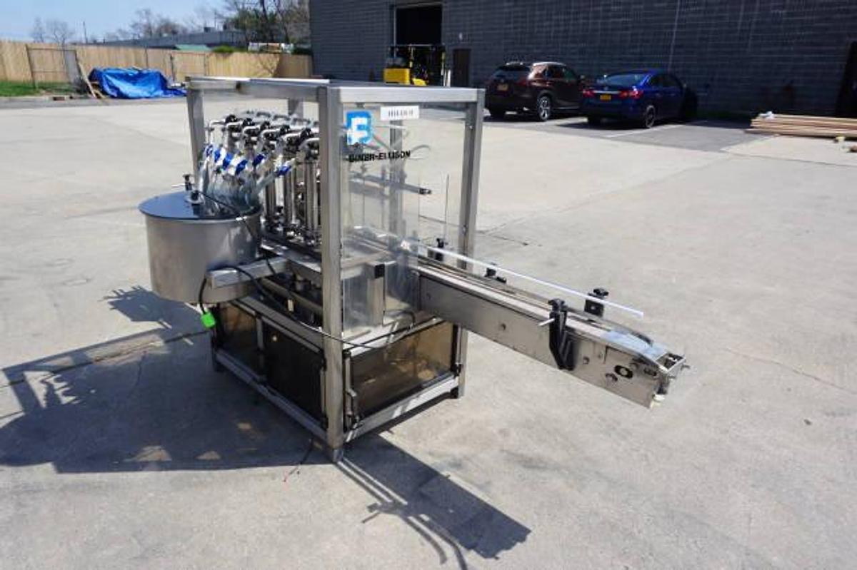 Used Biner Ellison Six Head Straight Line Piston Filling Machine