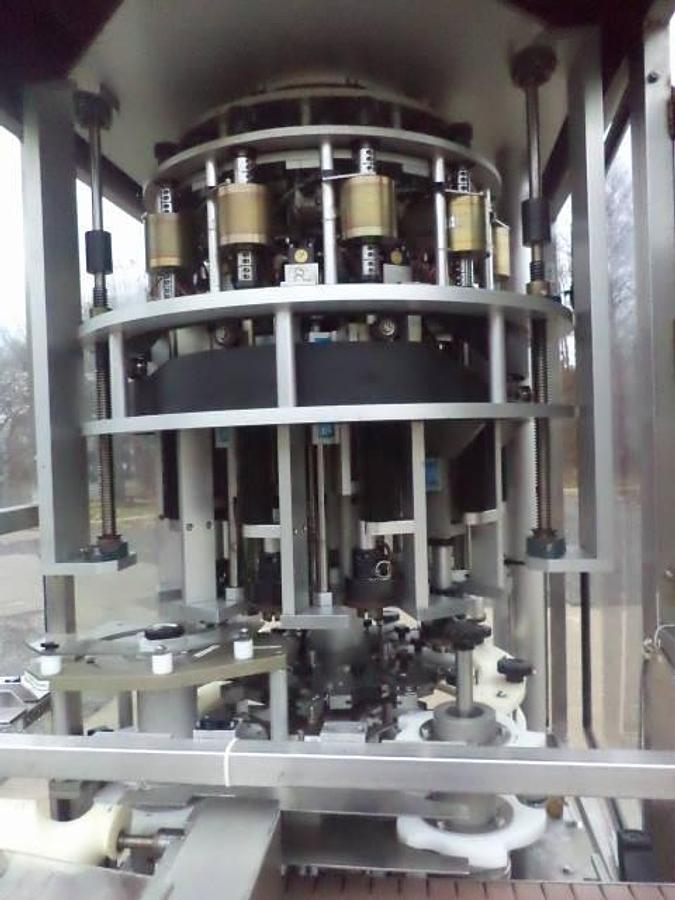 Used New England Machinery Ten Head Rotary Capper With  Feeder/Unscrambler