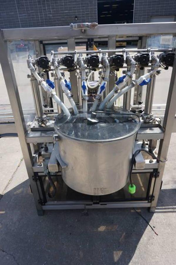 Used Biner Ellison Six Head Straight Line Piston Filling Machine