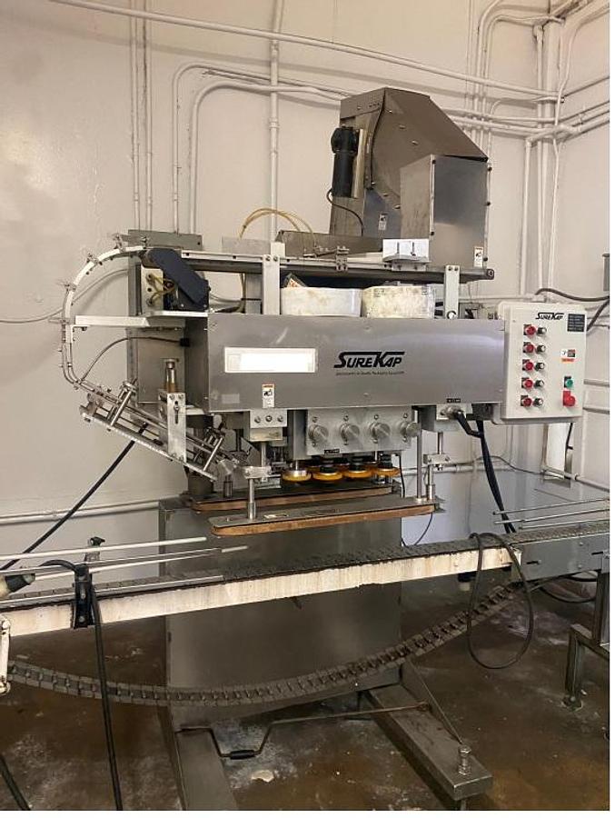 Used Surekap Eight Spindle SS Capper , With Cap Elevator