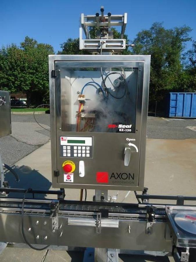 Used Axon Ez-130 Sleeving System With Twin Shrink Tunnels, 15 Ft. Conveyor