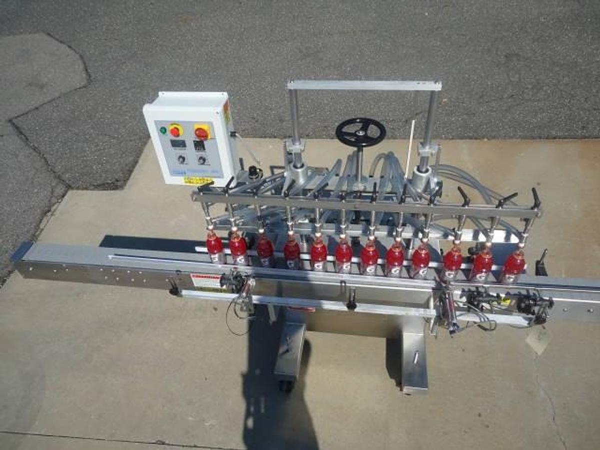 Used Kaps-All Twelve Spout Inline Pressure Filler Model Fa-P