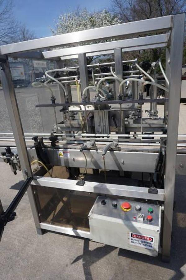 Used Biner Ellison Six Head Straight Line Piston Filling Machine