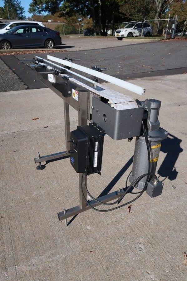 Used 4-1/2 In. Wide X 57 In. Long Motorized Bottle Conveyor, Variable Speed