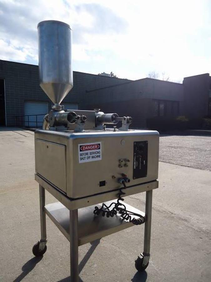 Used Kalish  Pcl/2 Twin Head Piston Filler