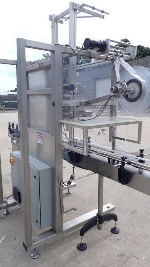 Used Aesus “Delta” High-Speed Neck Bander with Shrink Tunnel
