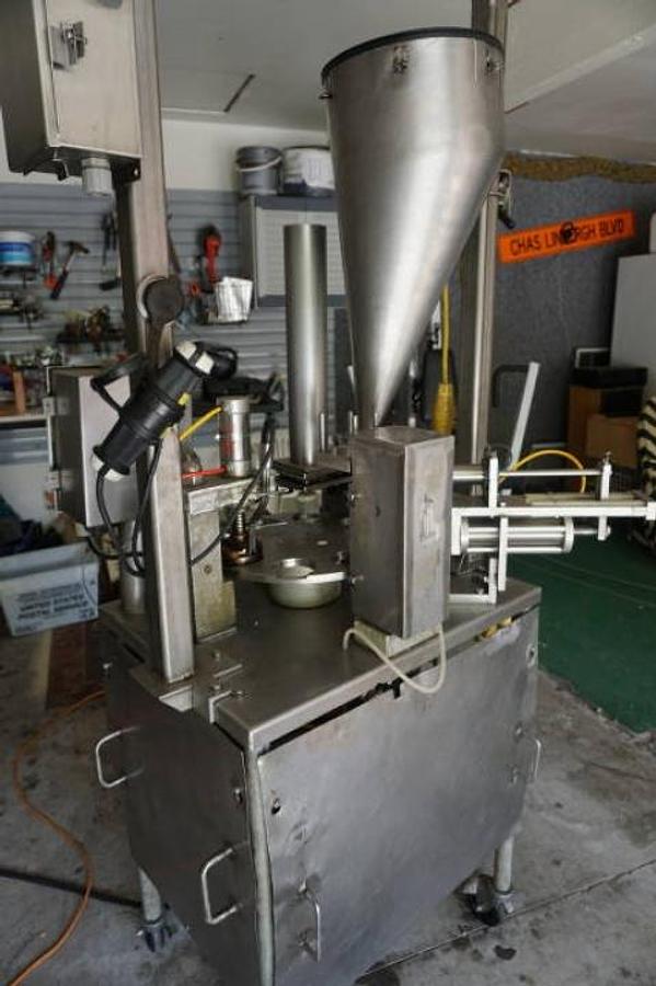 Used World Cup Model 8-12 Rotary Cup Filling/Sealing Machine, 45 Per Minute