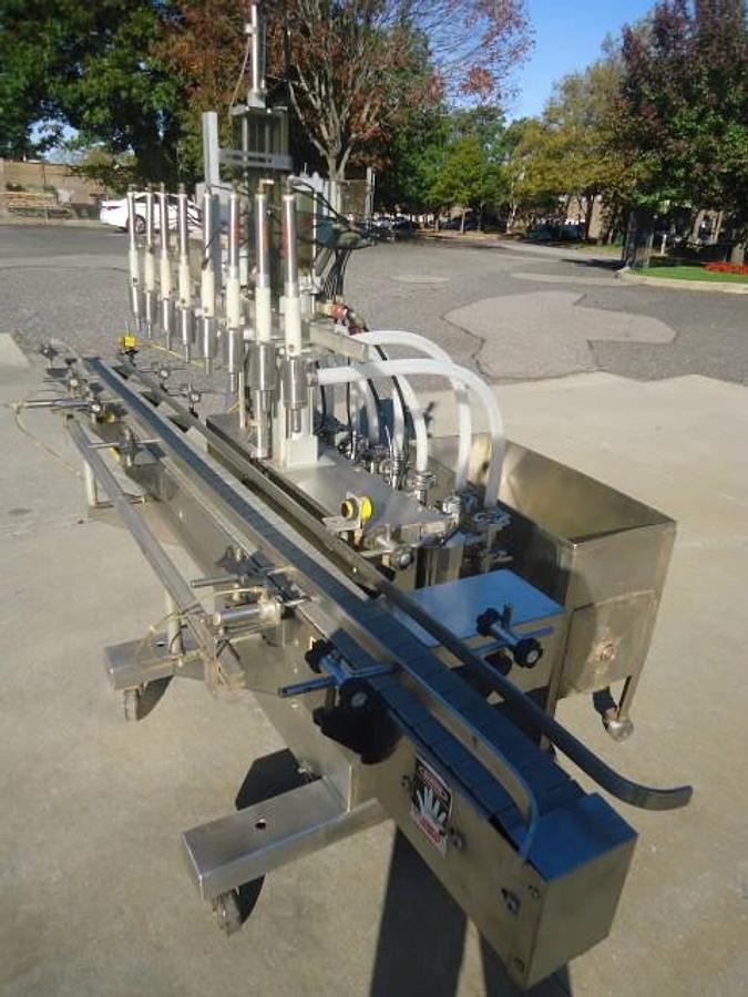 Used Kaps-All/Fills-All 8 Piston Automatic Filler, With Conveyor