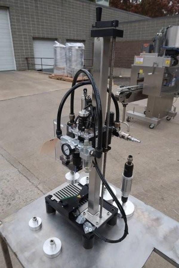 Used Kinex Air Operated Chuck Style Capper with Bench Top Table