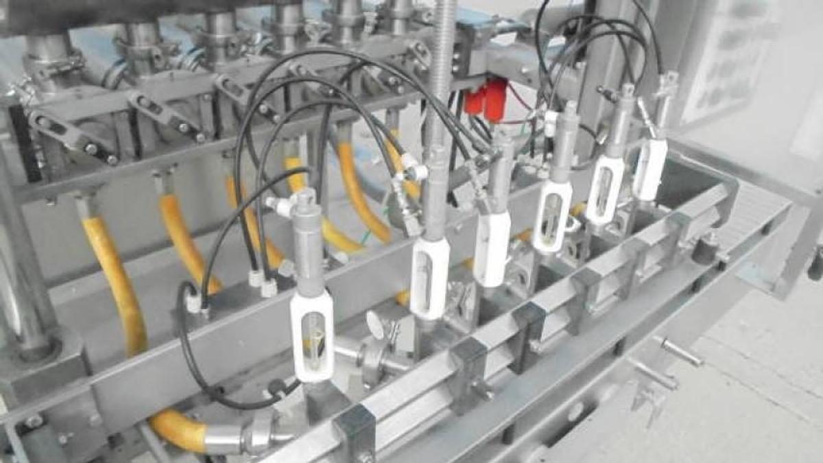 Used MRM/Elgin Six Piston Inline Filling Machine, 94 ounce pistons