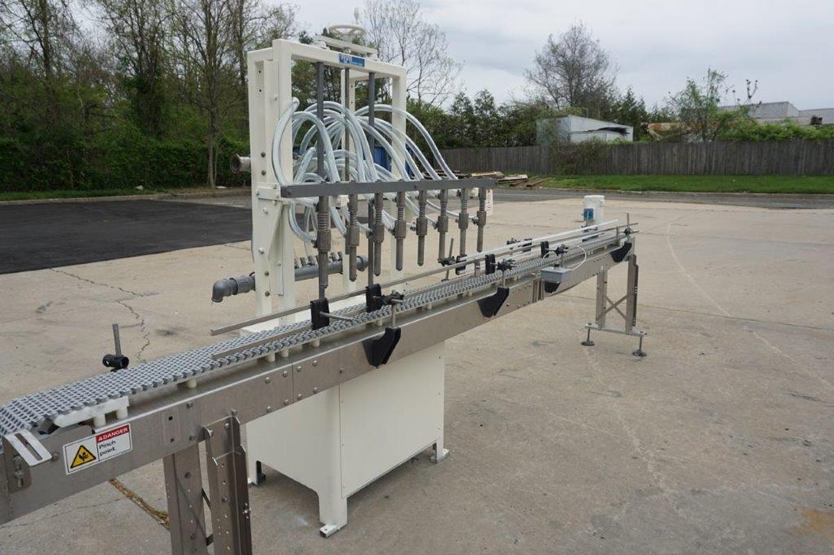 Used RJM 8 Spout Straight Line Liquid Filling Machine, Pressure Gravity Nozzles