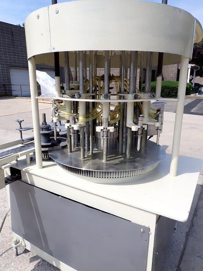 Used New Way 12 Spout Rotary Pressure Gravity Liquid Filling Machine, 8-1/4 In. Centers
