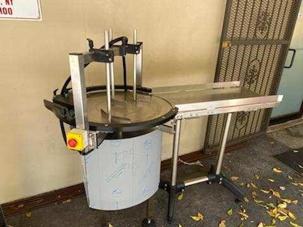 Used CDA Bottling Line with Rotary Tables