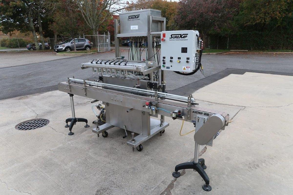 Used Surekap 8 Head Inline Auto Piston Filler, Explosion Proof