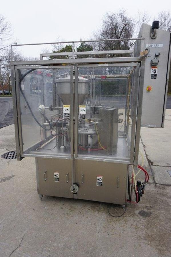 Used Modern Packaging MR Series Rotary Cup Filling and Sealing Machine